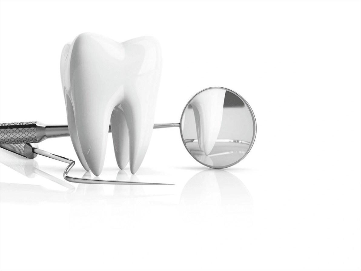 A tooth with wires and mirror on the table